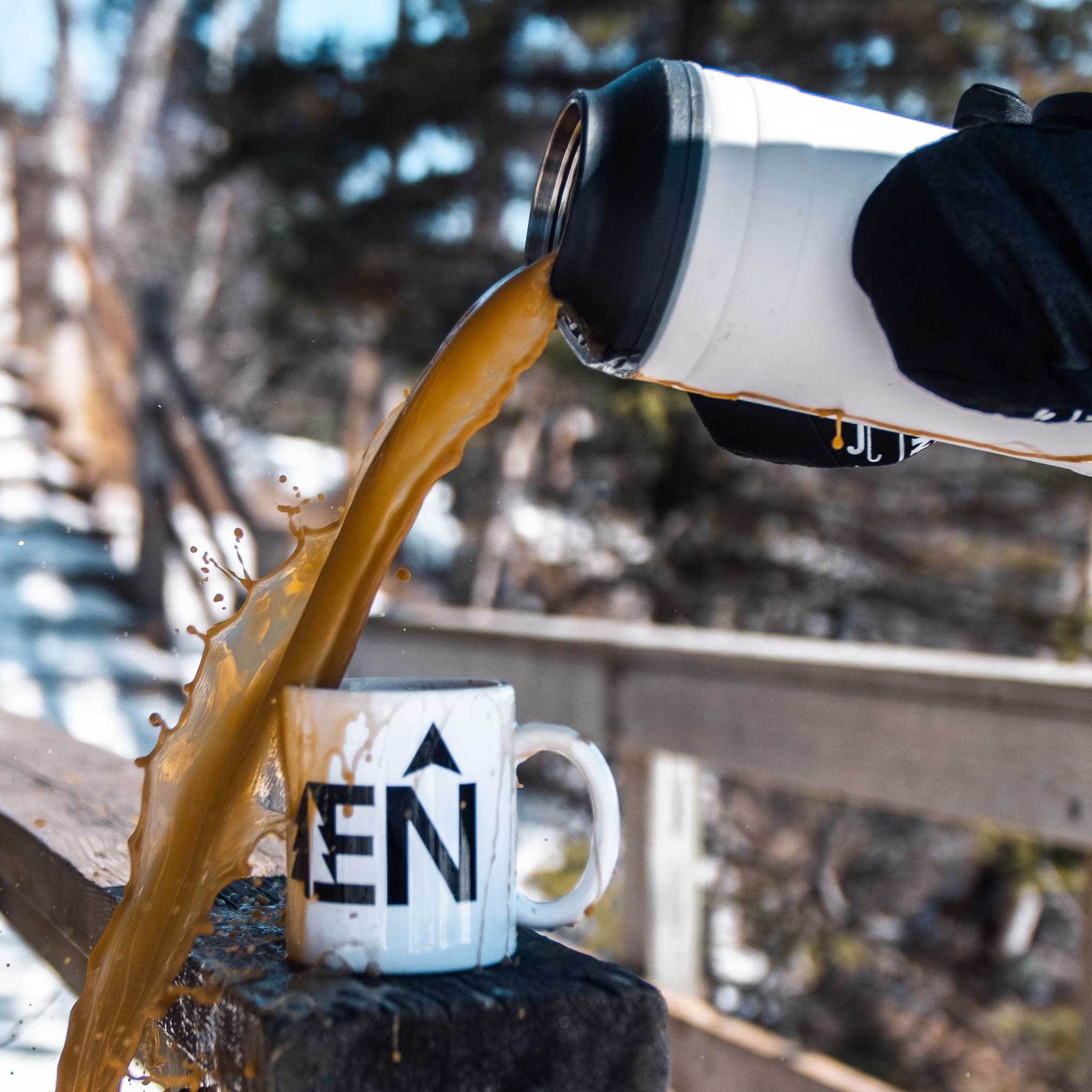 White 64oz Pelican Bottle Coffee Pouring